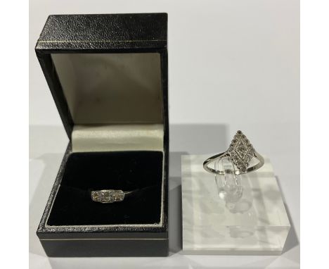 An Art Deco 18ct white gold and platinum diamond set navette shaped ring, pave set with diamond chips, size P, 2.6g; an 18ct 