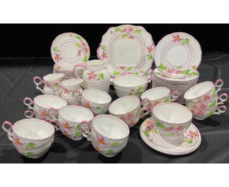 A Gainsborough Adderley Ware tea service for sixteen, decorated with pink flowers, comprising cake plates, side plates, cream