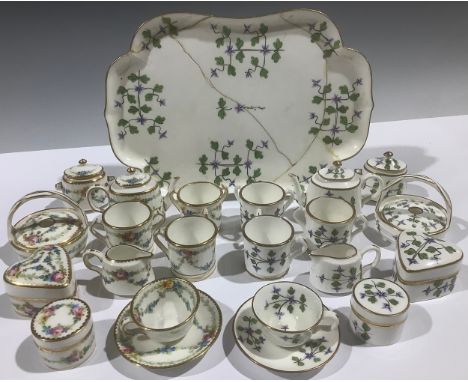 A Mintons miniature tea service, decorated with cornflowers, comprising teapot, sucrier and cover, cream jug, cup and saucer,