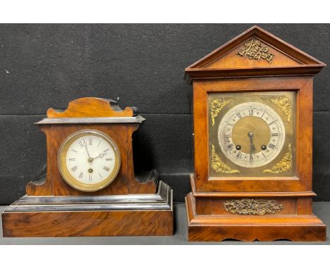 An Edwardian architectural walnut mantel clock, Roman numerals on silvered chapter ring, twin winding holes, 36cm high; anoth