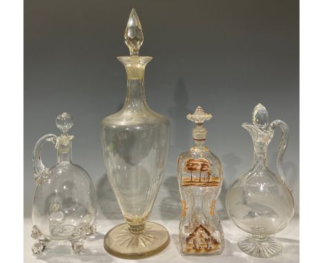 A large 19th century glass ovoid pedestal decanter, pointed prismatic stopper, star-cut base, 55cm high, c.1860; A 19th centu