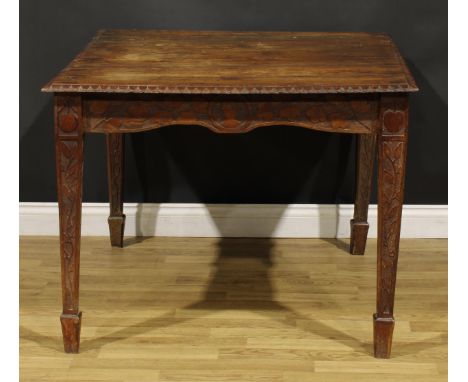 An Arts &amp; Crafts period oak table, rectangular top, the underframe carved throughout in the Art Nouveau taste with meande