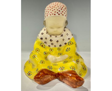 A Berthe Savigny Quimper figure, modelled as a seated child, wearing a bonnet, a nightdress, and clogs, signed painted mark, 