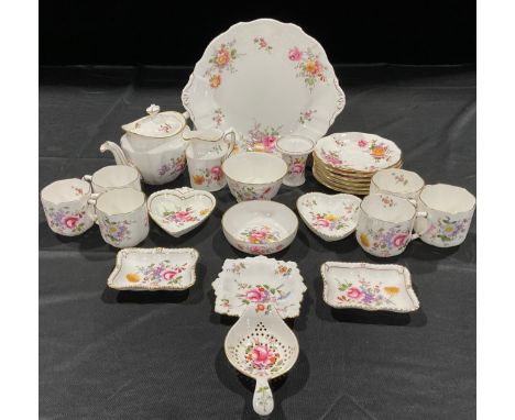 A Royal Crown Derby Posies tea service, comprising a teapot and cover, tea strainer on stand, sixcups, six saucers, sugar bow