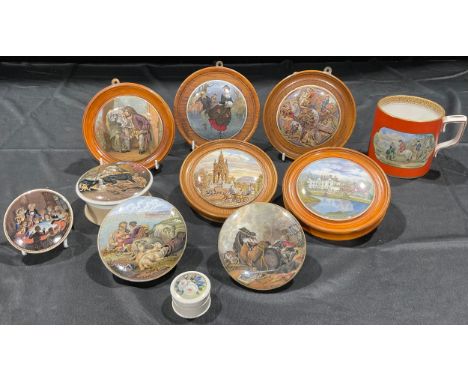 A collection of Staffordshire Prattware pot lids, including Albert Memorial, War, Peace, Snap Dragon, The Skaters, Sandringha