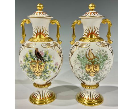 A pair of Royal Crown Derby two handled pedestal baluster vases and covers, printed and painted with Green Man masks, trailin