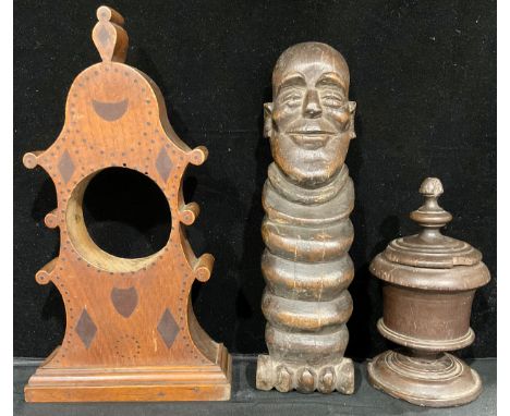 Treen - A Dutch style Edwardian oak clock display case, inlaid with clavo border, 35cm high; a mahogany turned urn shaped jar