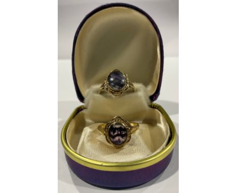 A 9ct gold mounted Derbyshire Blue John ring, single oval polished cabochon, size R, marked 375, Sheffield 1990, 2.7g; a simi