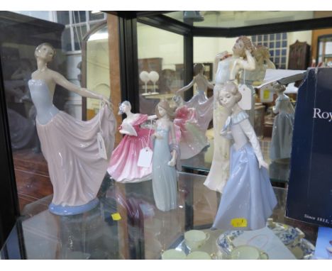 A Lladro figure of a girl holding out her skirts, 31cm high, another Lladro figure , a Nao figure of a girl with a fan and tw
