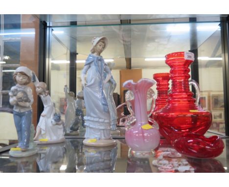 A Nao figure of a girl in bonnet, 32cm high, two other Nao figures and three coloured glasswares