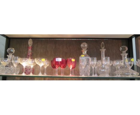 Five various glass decanters including a ship's decanter and various drinking glasses including ruby bowled glasses