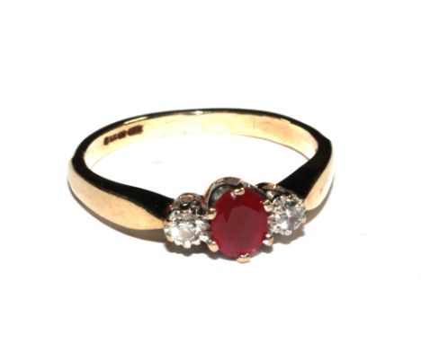 A three stone ruby and diamond ring set in 9 carat gold