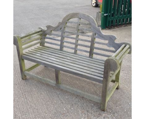 A hardwood slatted garden bench 