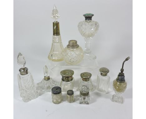 An early 20th century glass scent bottle, with a silver screw cover, together with an inkwell and various silver mounted scen