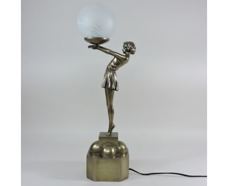 An Art Deco style figural table lamp, with an opaque white glass shade, 57cm tall
