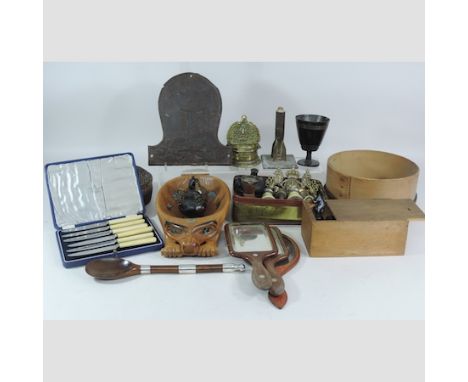 A box of carvings and decorative items, to include an Eastern brass stand, bronzed pots, a horn beaker and opera glasses etc