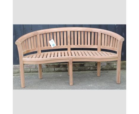 A teak curved garden bench, 154cm 