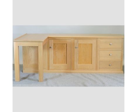A contemporary light oak corner desk, 206cm