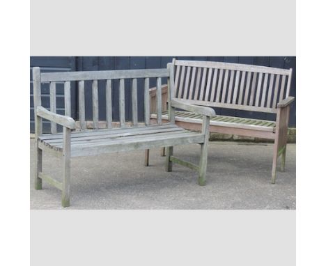 A hardwood slatted garden bench, 122cm, together with another similar 