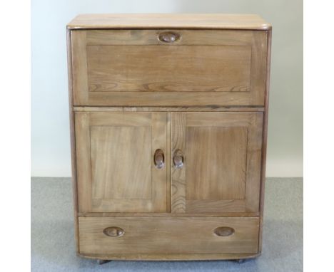 An Ercol light elm drinks cabinet, 83cm