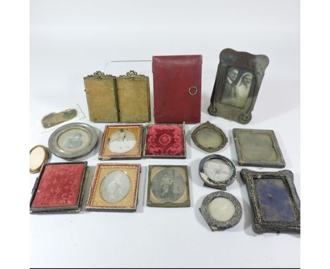 A Victorian daguerrotype portrait of a lady, in an ornate gilt and leather hinged case, 9 x 8cm overall, together with a coll