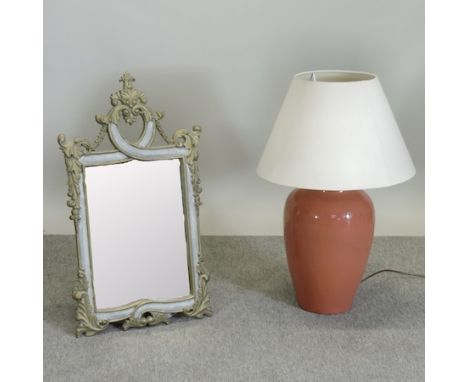 A Jim Lawrence glazed pottery table lamp and shade, 69cm tall, together with a scrolled wall mirror