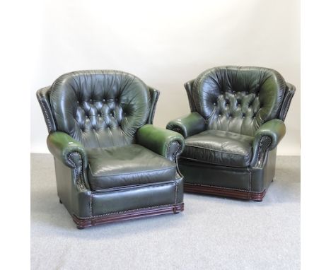 A pair of modern green leather button back armchairs 