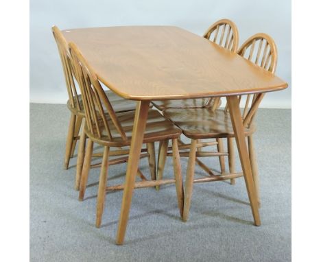 An Ercol light elm rectangular dining table, 153 x 79cm, together with a set of four spindle back dining chairs