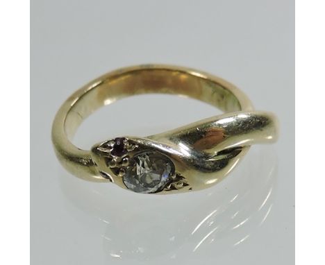 An unmarked diamond crossover ring, in the form of a snake, with ruby eyes, cased