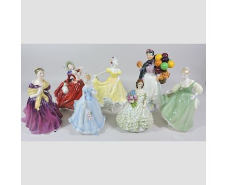 A Royal Doulton figure, Biddy Penny Farthing, H.N.1843 together with a Worcester figure and five others, tallest 23cm