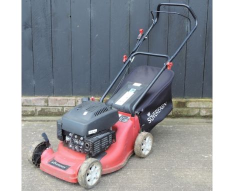 A red Sovereign petrol rotary lawn mower, with manual 