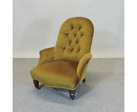 A Victorian green upholstered button back nursing chair, on turned legs