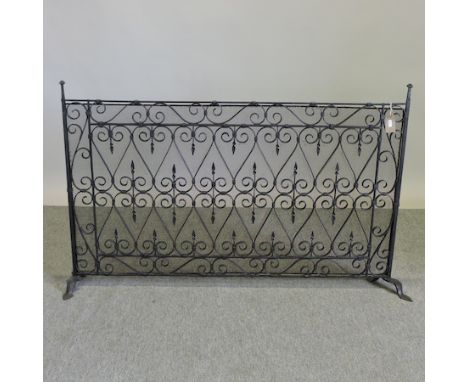 A black painted wrought iron fire screen, 81 x 60cm
