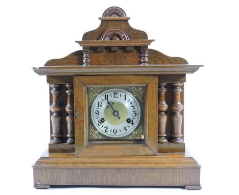 An Edwardian walnut cased mantle clock, with a painted dial, 38cm tall
