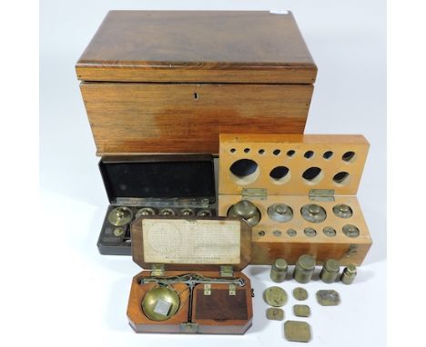 A mahogany jewellery box, 27cm, together with a set of weights, boxed, another, loose weights and a pair of jewellery scales,