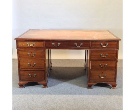 An early 20th century mahogany partners pedestal desk, on shaped bracket feet, 152cm 