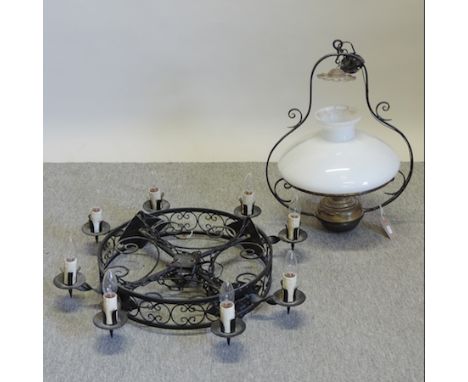 A black painted iron chandelier, 72cm diameter together with a hanging oil lamp with a white glass shade 