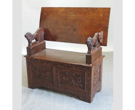 An early 20th century carved oak monk's bench, 107cm