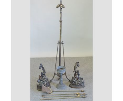 An ornate pair of Victorian fire dogs, together with a telescopic standard lamp and a companion set