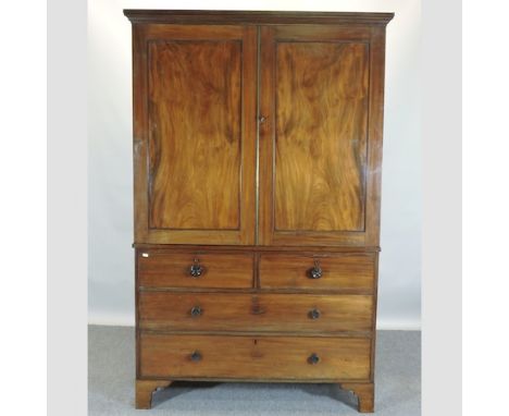 A George III mahogany linen press, fitted with slides, on bracket feet, 128cm