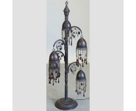 A Moroccan style metal and beaded table lamp, 112cm tall