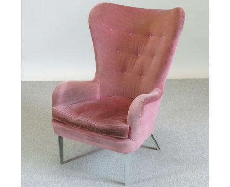 An Earnest Race DA1 pink upholstered button back armchair, made for Heals, with a metal frame, on chrome legs