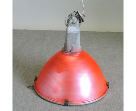 A red painted metal industrial light fitting, 60cm diameter