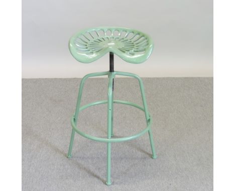 A green painted metal tractor seat stool, 47cm