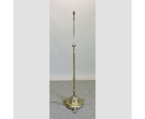 A Victorian brass telescopic standard lamp, on paw feet