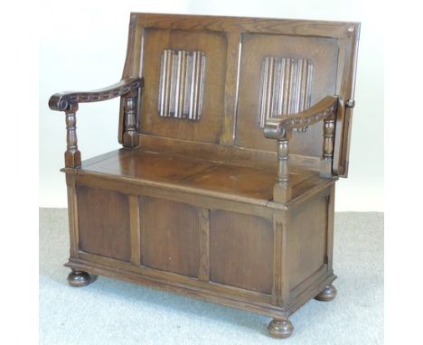 A carved oak monk's bench, 95cm