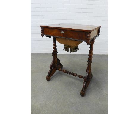 19th century rosewood sewing table, the serpentine top with a lift up section, opening to reveal a fitted interior with sever