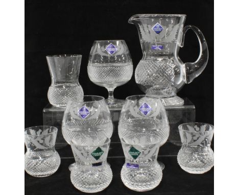 Edinburgh Crystal thistle pattern wares to include a water jug, three brandy glasses, set of four whisky tumblers and an unma