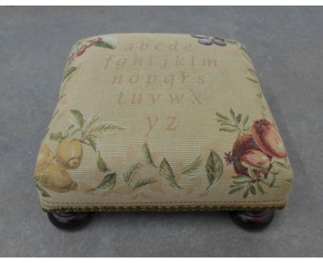 Small tapestry footstool on bun feet. 17 x 34 x 34cm. 