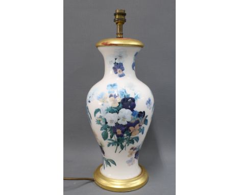 A decoupage effect table lamp, probably Vaughan of Chelsea, of baluster form with turned gilt wood foot and cap, 40cm high, e